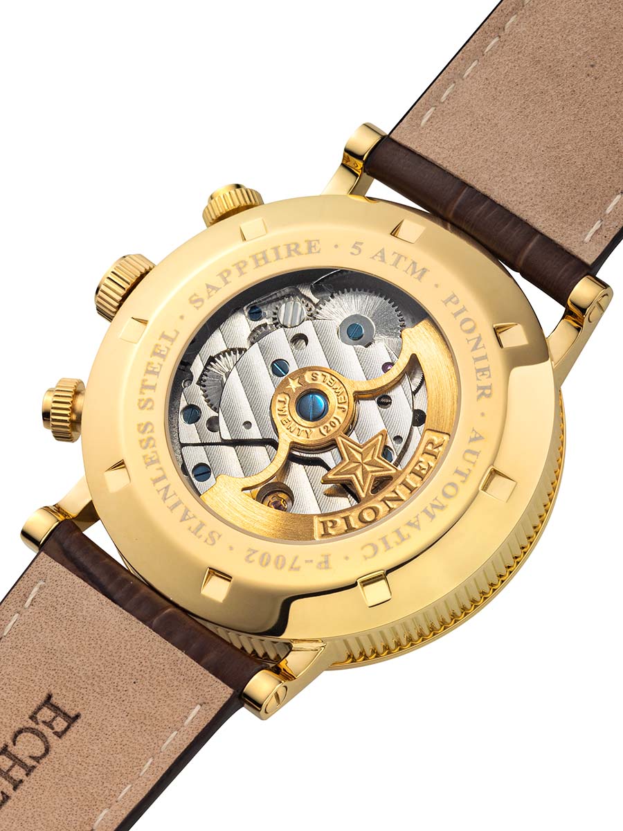 Gold Pionier watch with brown leather strap on a white background and engraved rotor.