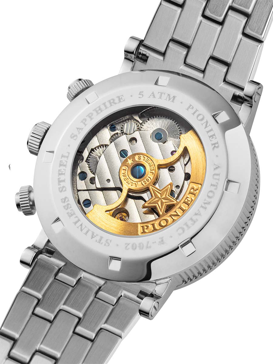Close-up of a silver watch with visible mechanical components and brand name on a white background