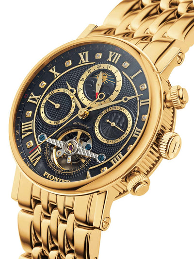 Multi-tone black dial with gold color Roman numerals on it.