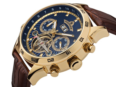 Push buttons for the calendar with a blue multi-tone dial and gold color stainless steel case.