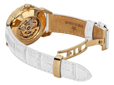 Open back case to view the gold color mechanism and deployment buckle for the band.