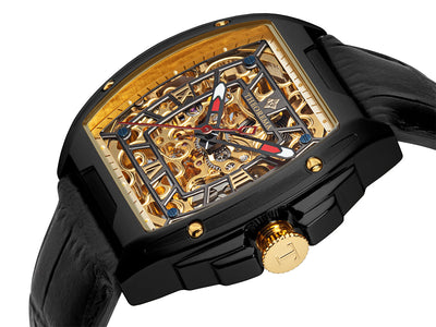 Black stainless steel case with black leather band and a gold color crown with a T engraved on it.