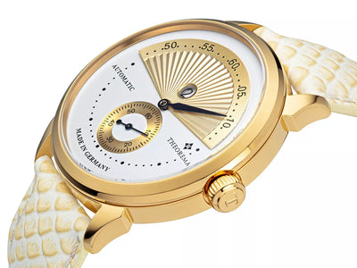 Arabic numerals watch with gold case and gold crown button.